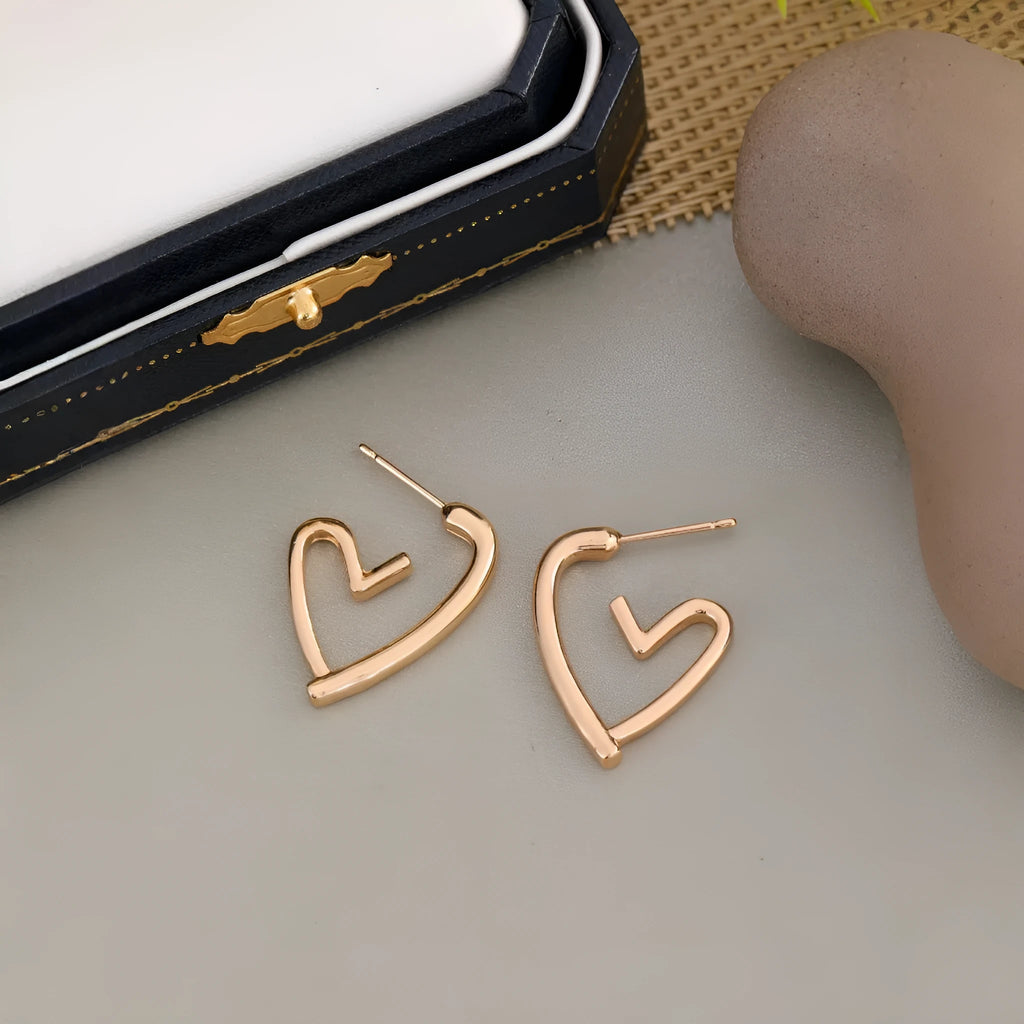 Gold-tone metal simple cold style love dangle earrings for women in golden colour