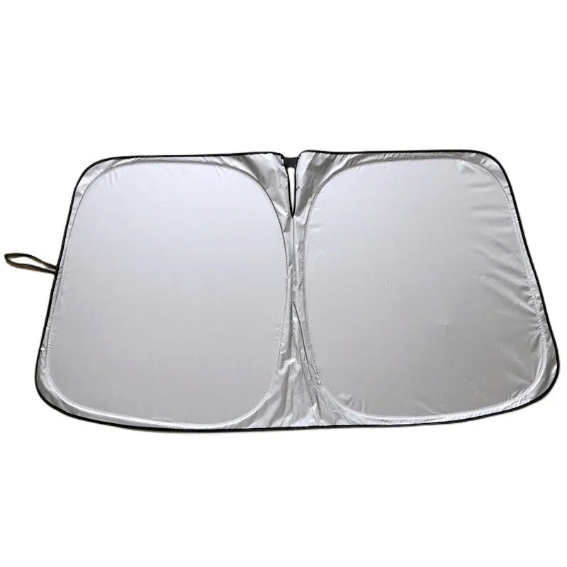 Aluminium foil car windscreen sunshade in silver, showing reflective surface.