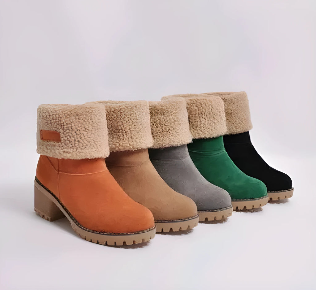 Women's mid-tube suede snow boots with thick construction and flat heel in multiple colour options