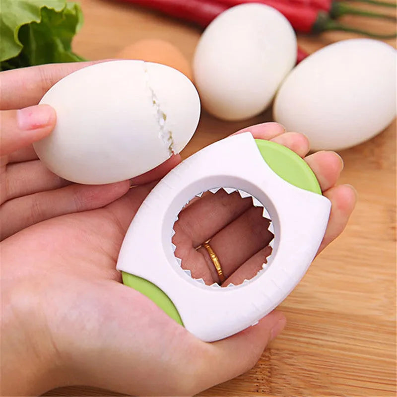 Blue egg topper gadget with stainless steel cutter and built-in strainer on white background
