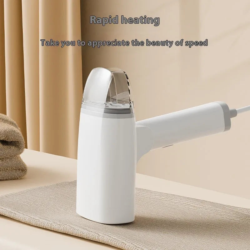 Blue handheld garment steamer with water tank and steam nozzle for clothing wrinkle removal