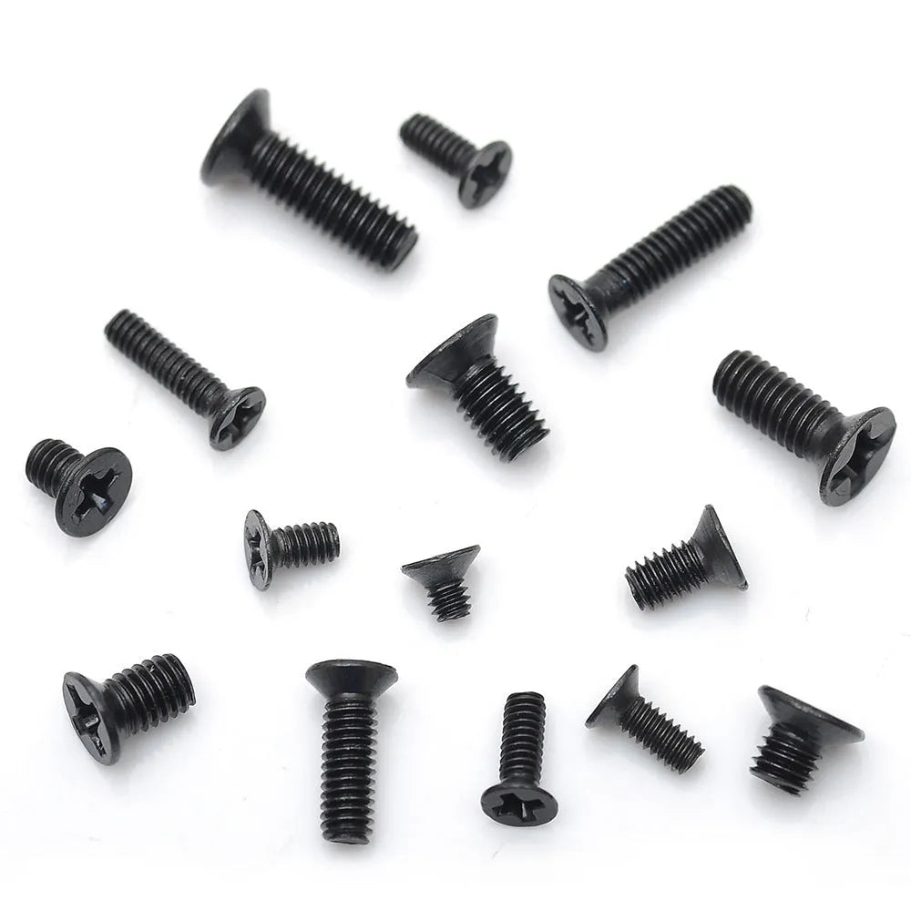 Flat head machine screw set carbon steel black plating 1.4mm diameter 16mm length on workbench