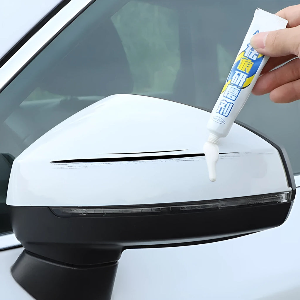 Automotive paint repair pen scratch repair fluid kit with paint pen, wax, sponge, and sandpaper.