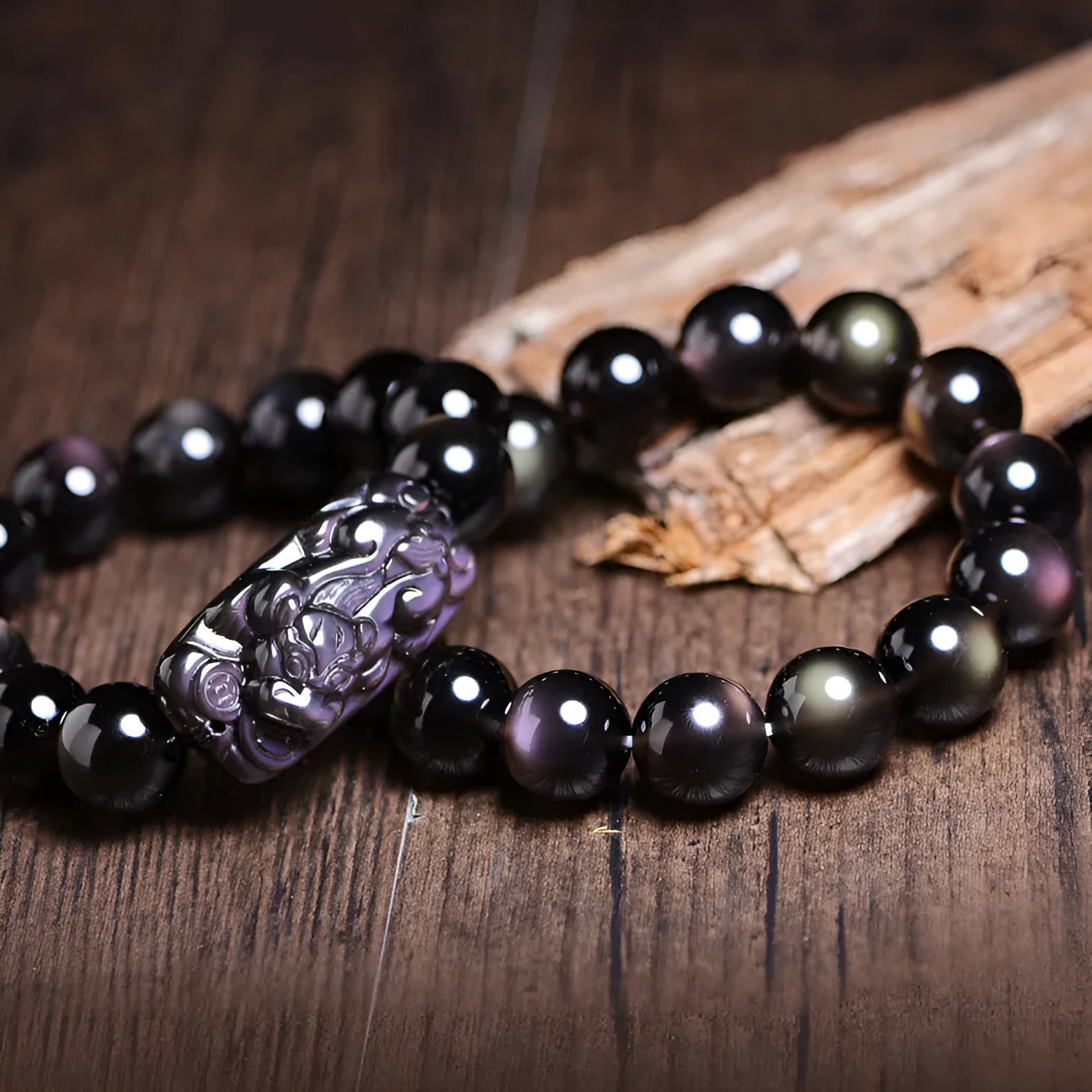 Genuine crystal icy obsidian Pi Xiu bracelet in geometric ethnic style on a neutral background.