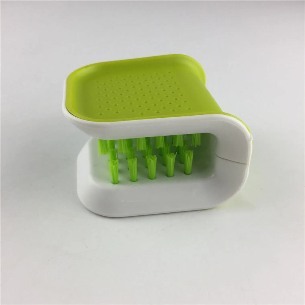 U-shaped knife and cutlery cleaner brush with ABS bristles in blue, resting on a kitchen counter