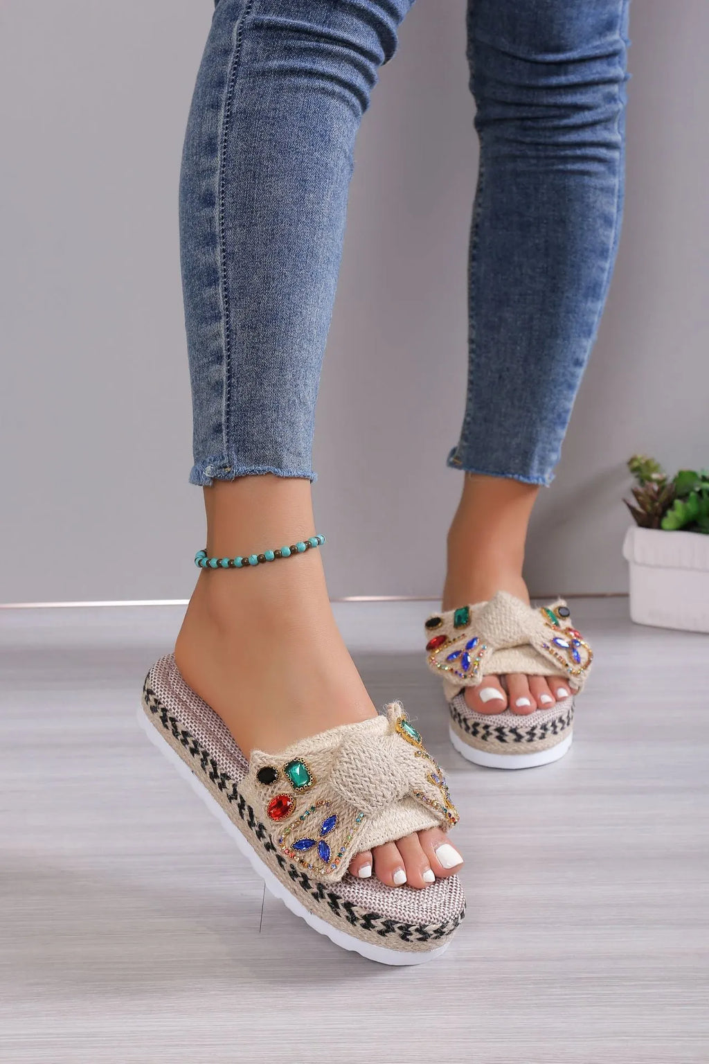Beige women's platform sandals with bow detail, round toe, and cloth upper