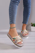 Beige women's platform sandals with bow detail, round toe, and cloth upper