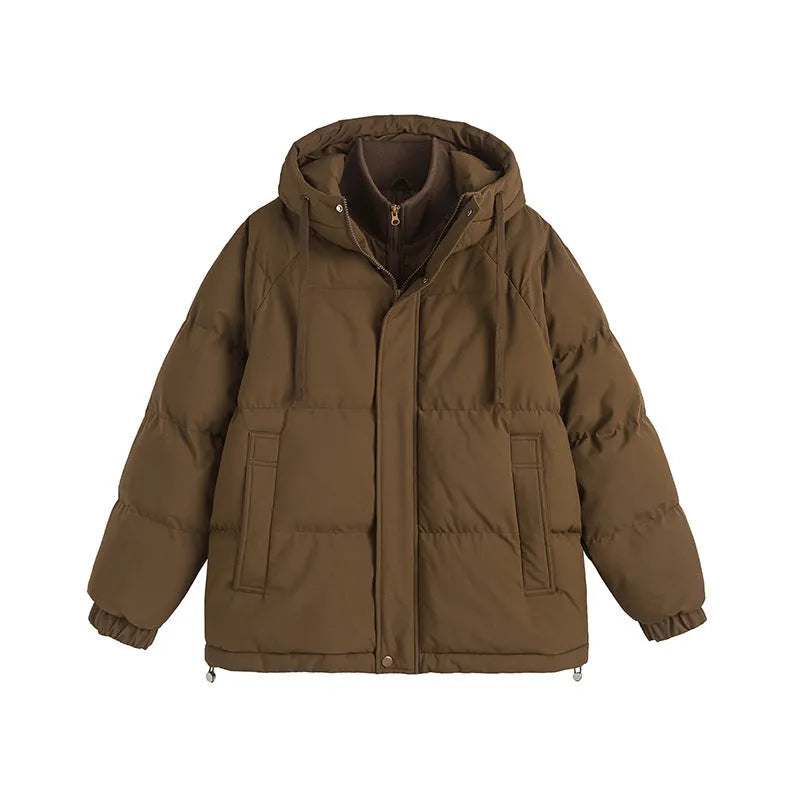 Beige loose fake cotton-padded winter jacket with side seam pockets on a mannequin.