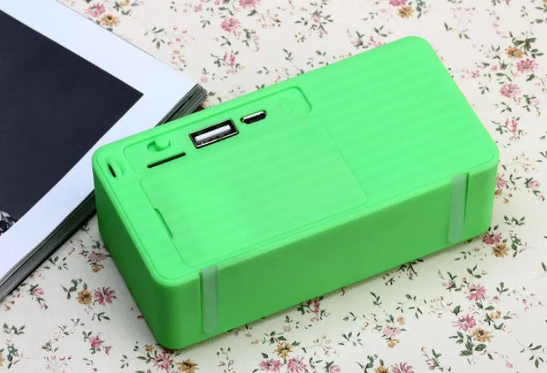 Cannon X3 Wireless Bluetooth Speaker cube in five colour options: black, blue, green, red, yellow