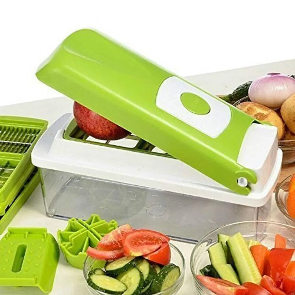 Green multifunctional vegetable chopper with handle, grater, and stainless steel blades on a chopping board