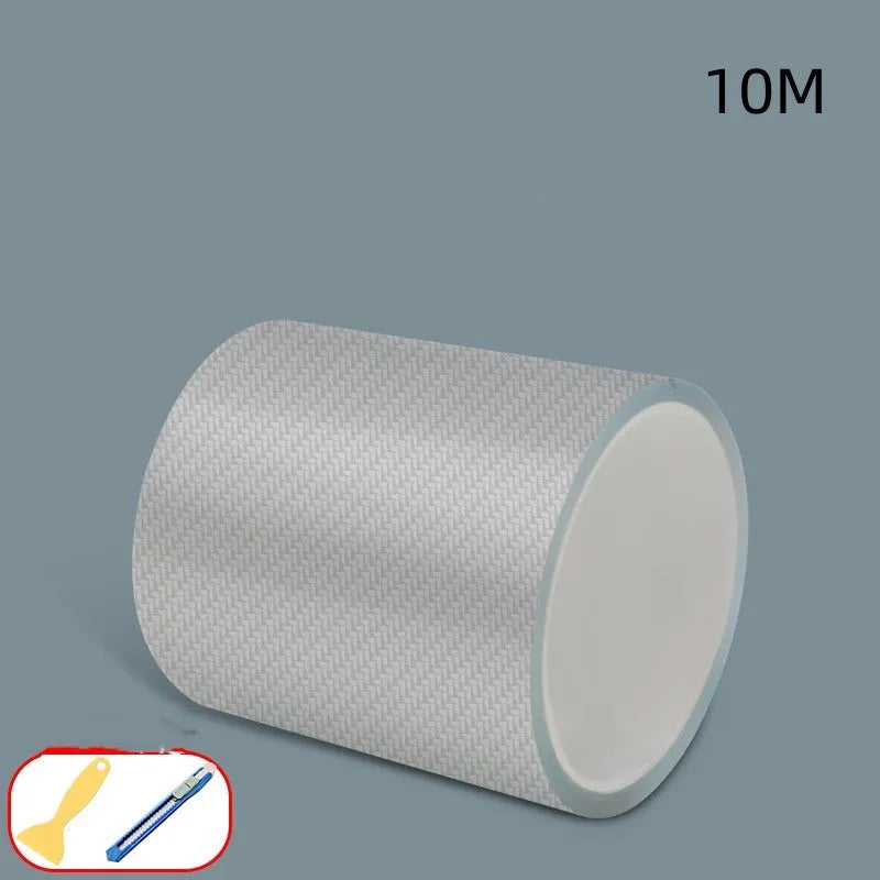 Roll of clear carbon fibre anti-collision film with scraper and utility knife for car door edges
