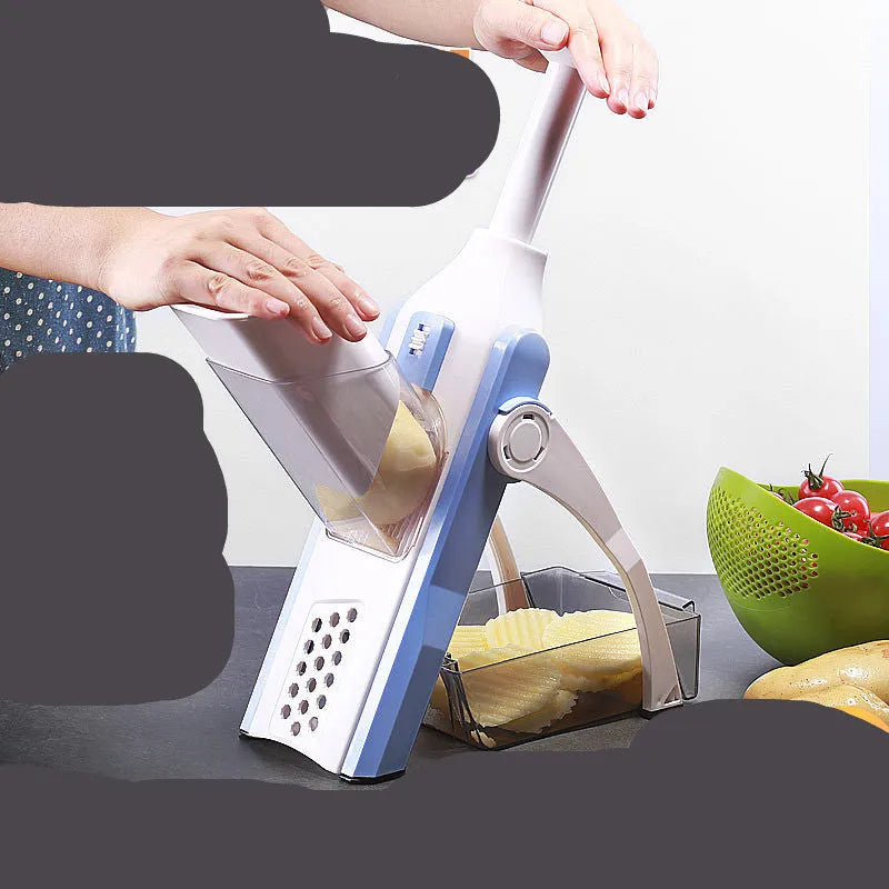 White and blue multifunctional vegetable slicer with stainless steel blade and cleaning brush on a kitchen counter