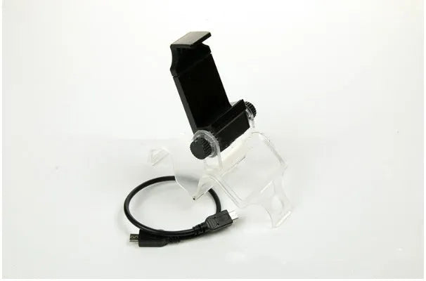 Black PS4 controller mount clip holding an Android phone with OTG cable connected, showing gaming setup