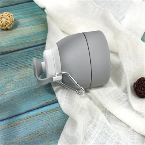 Silicone folding water bottle 580ml in grey, collapsed and full size, food grade portable sport bottle