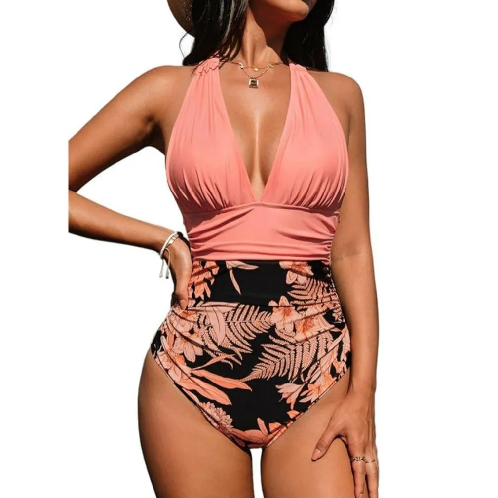 Women's black halter neck one-piece swimsuit on a hanger.