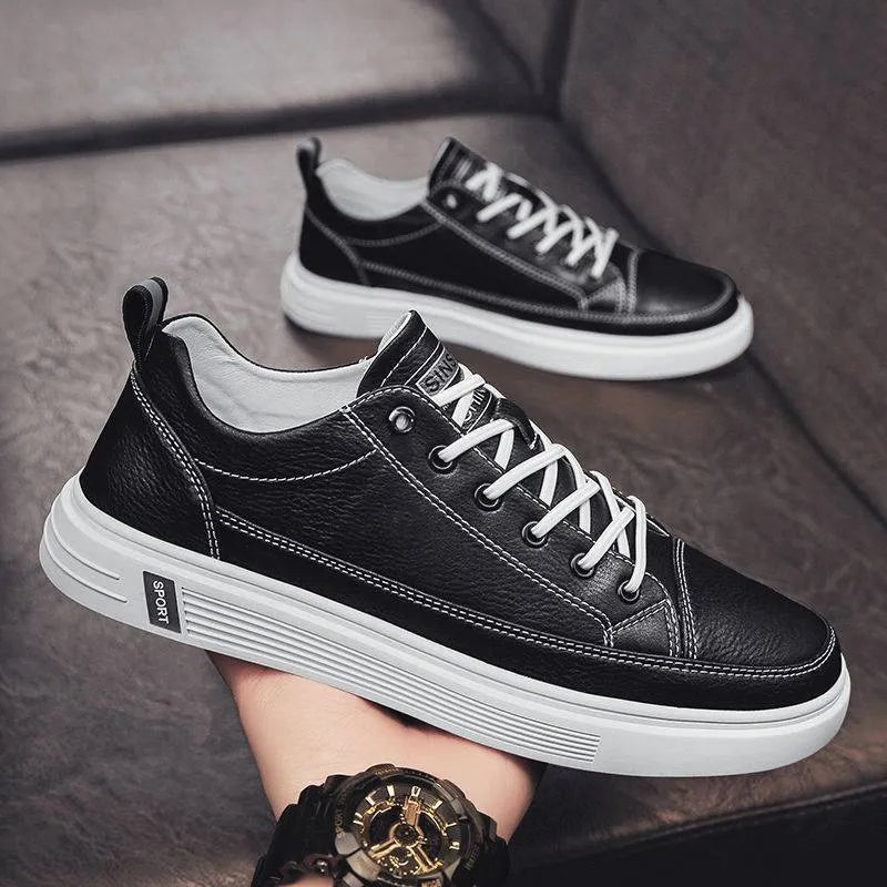 White casual men's shoes with round toe and flat low-heel design on neutral background
