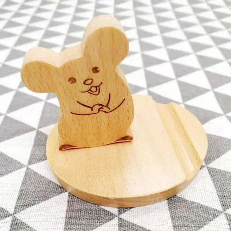 Beech wood mobile phone holder with resin animal design and coin slot