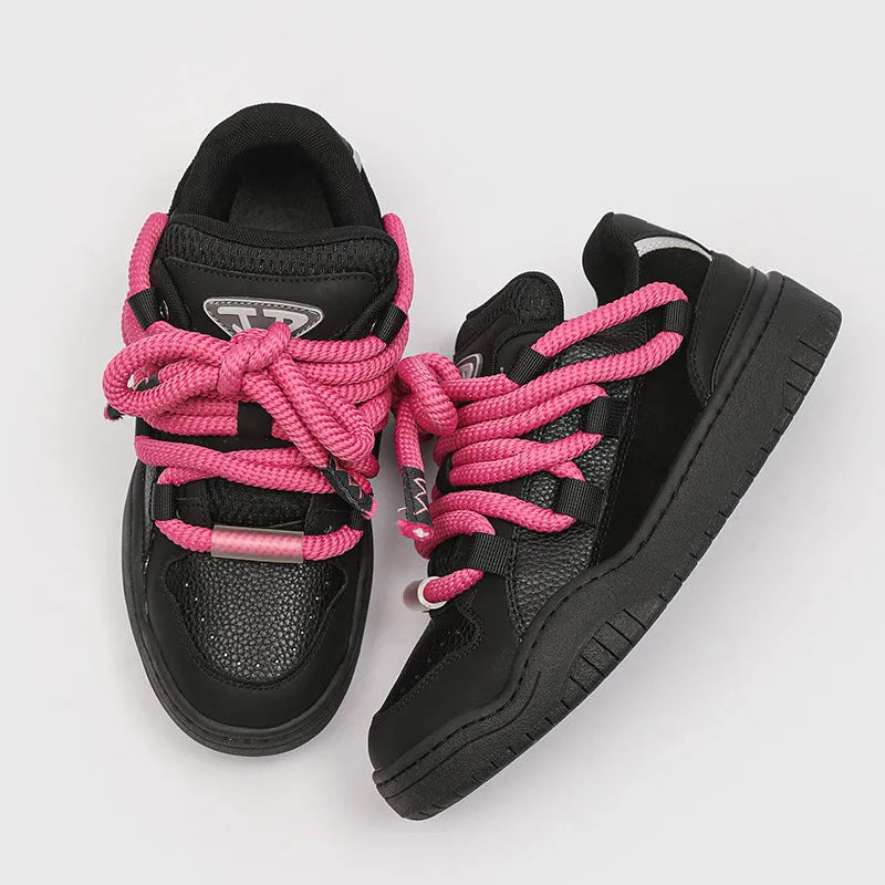 A pair of solid-colour casual lace-up shoes with a thick rubber sole and round toe