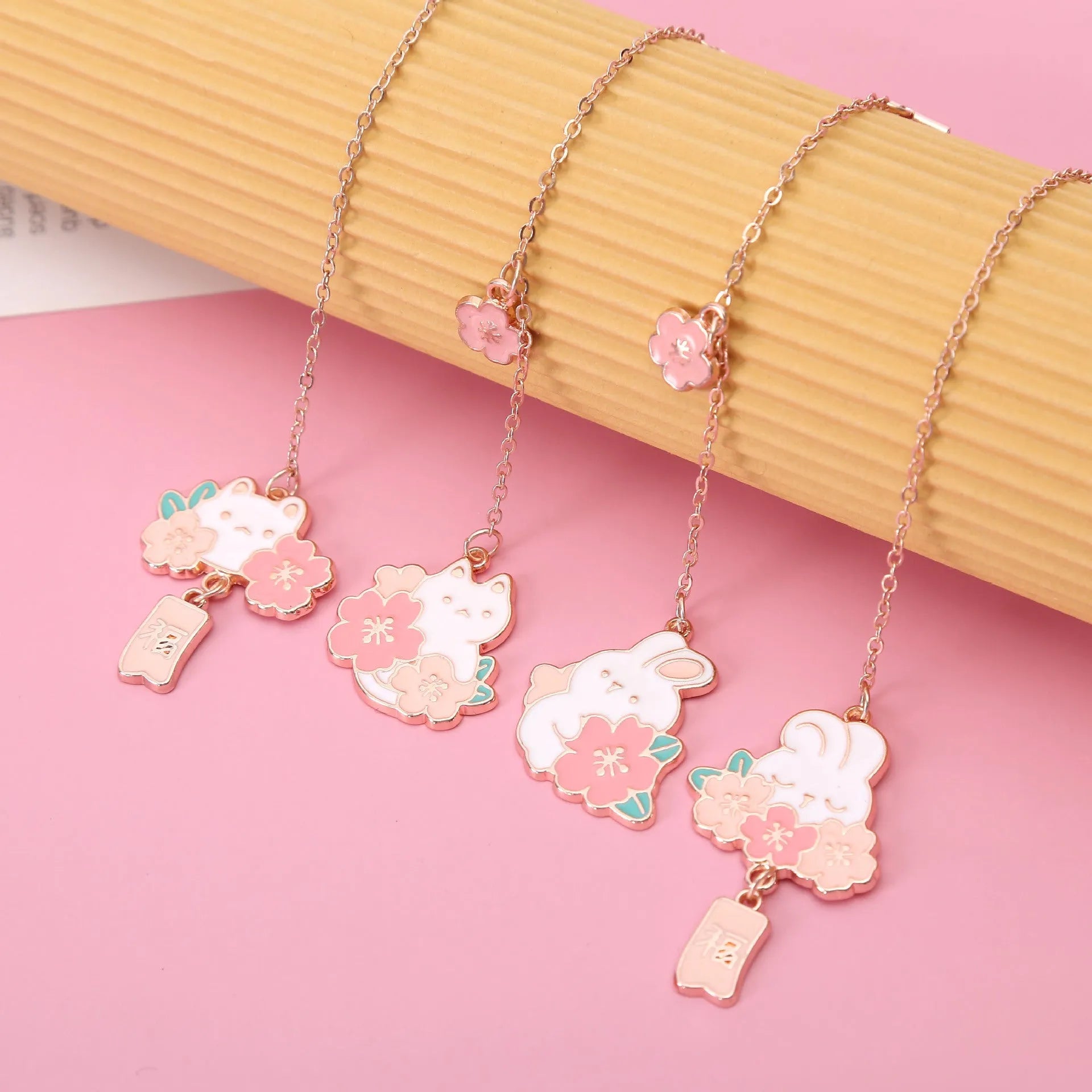Creative cartoon metal pendant bookmark featuring cherry blossom cat or rabbit design, student book holder
