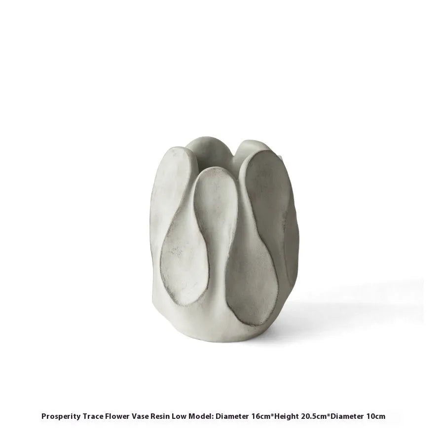Irregular ceramic vase in magnesium clay for flower arrangements on wooden surface