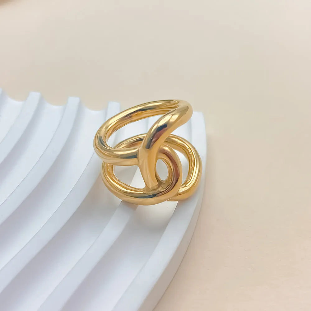 Women's stainless steel adjustable opening ring with knot design in gold or steel colour