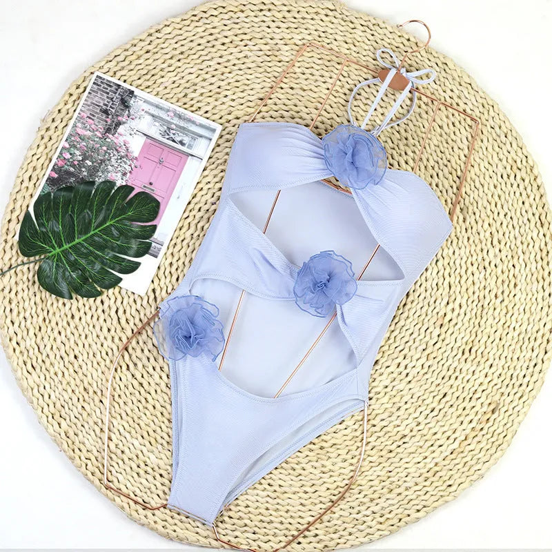 Women's 3D flower one-piece nylon swimsuit available in black and blue stripes, sizes S to XL