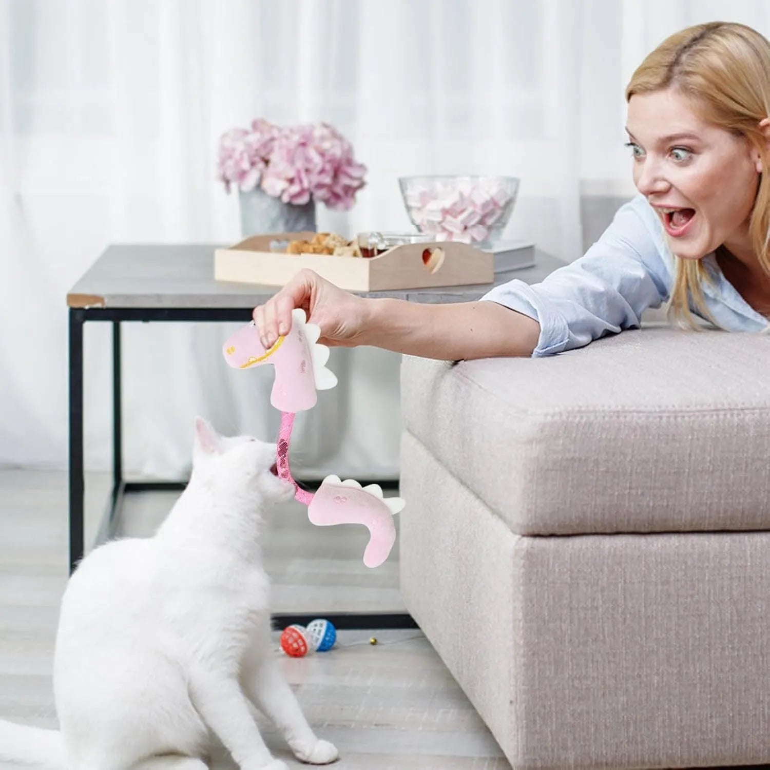 Four-piece cat toy set with rope, springs, and kicker toys in pink, purple, and yellow colours.