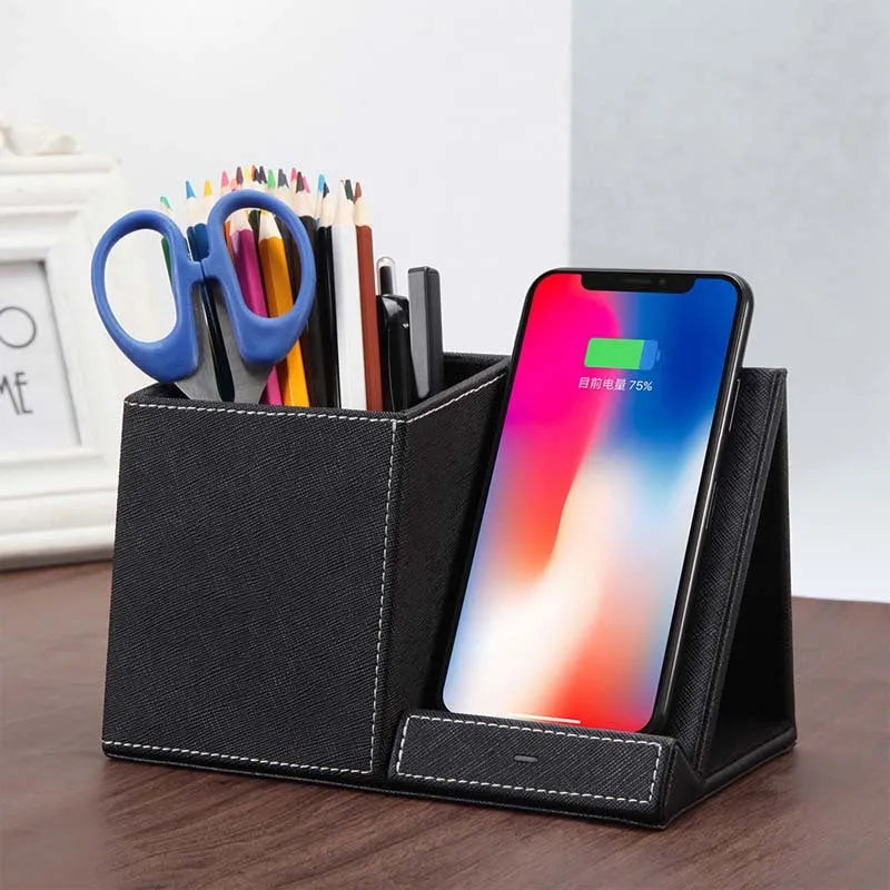 Leather pen holder wireless charger on desk with phone charging and pens organised