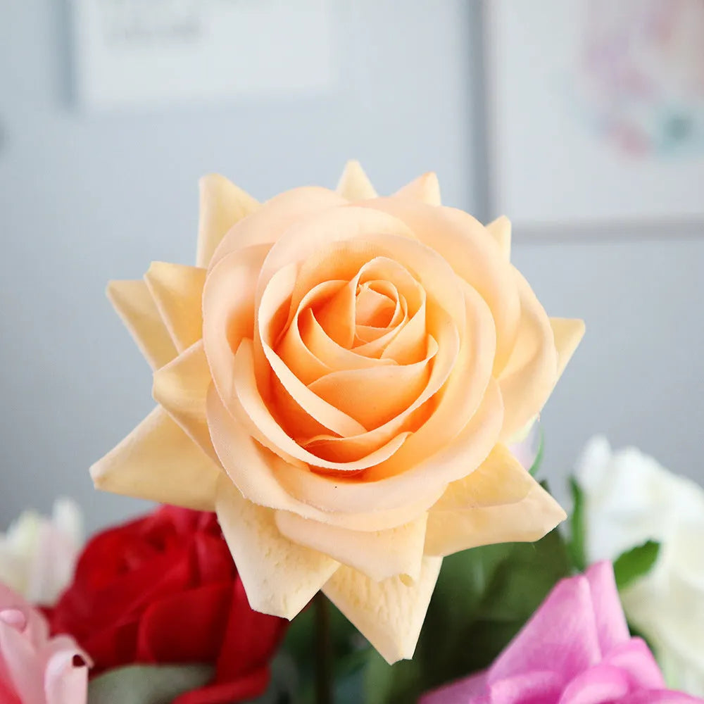 Artificial silk flower bouquet measuring approximately 42cm long with 8.5cm flower heads in multiple colour options