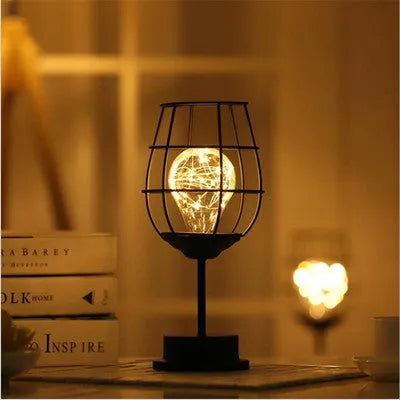 Iron hollow table lamp in red wine glass design with warm white LED lighting
