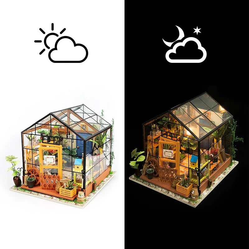 Robotime Kathy's Green Garden miniature doll house with LED light and glasshouse, finished display model on a shelf.