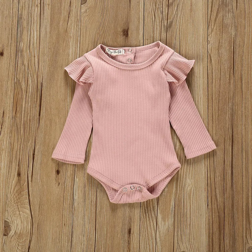 Women's pink cotton long sleeve top with size chart showing bust, length, waist measurements in centimetres