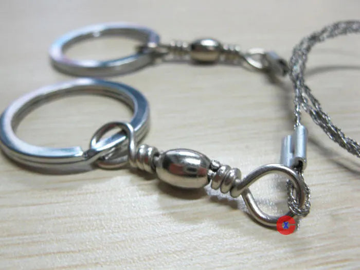 Outdoor survival wire saw with stainless steel blade, pull rings, and approximately 55cm cutting length