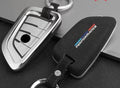 Suede key case with zinc alloy front frame in Classic Black, Charming Red, and Saddle Brown colour options