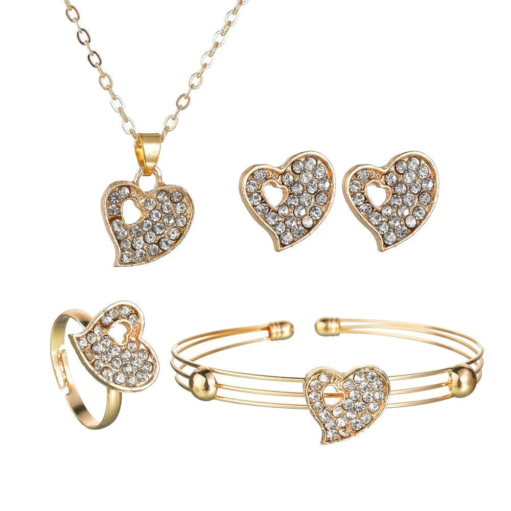 Gold electroplated alloy jewellery set showing earrings, pendant decoration, and hand decoration accessories
