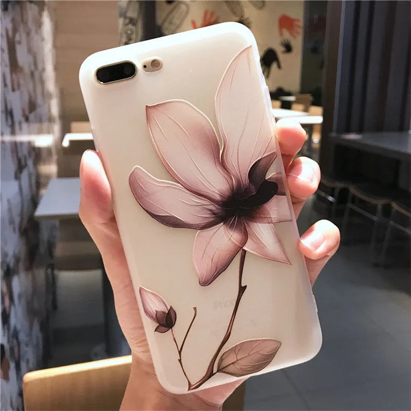 Black TPU iPhone case with embossed white flower design on back