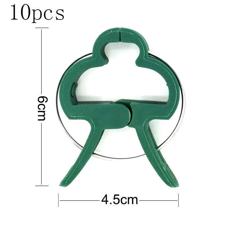 Green plastic plant fixing clips for climbing plants including tomatoes and beans