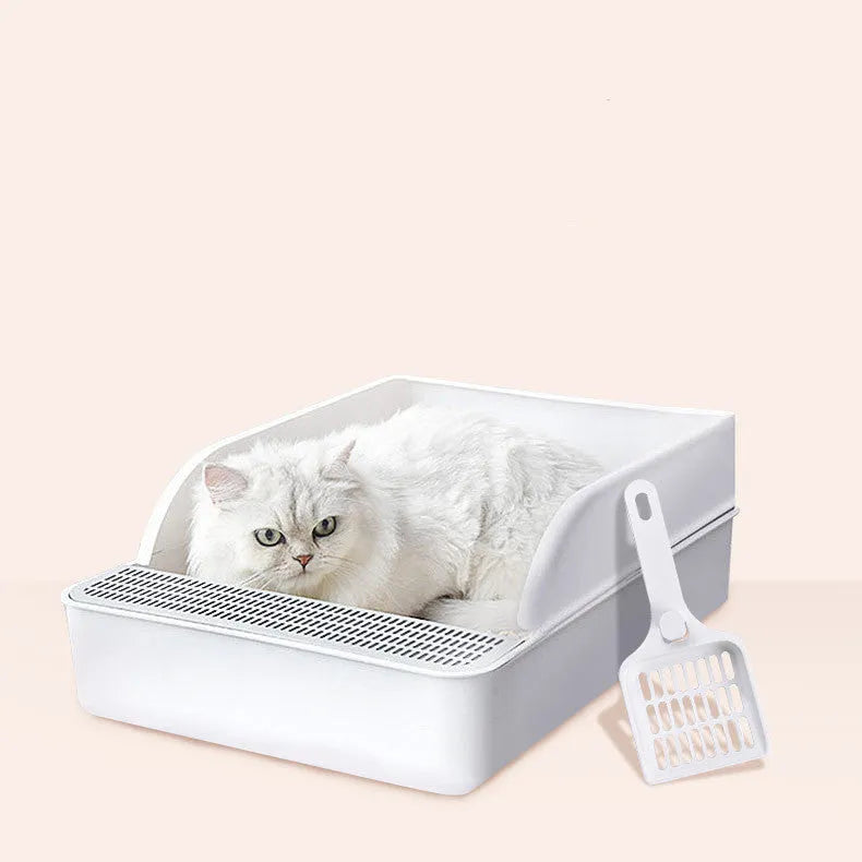White semi-enclosed cat litter box size S made of PP plastic on a clean floor