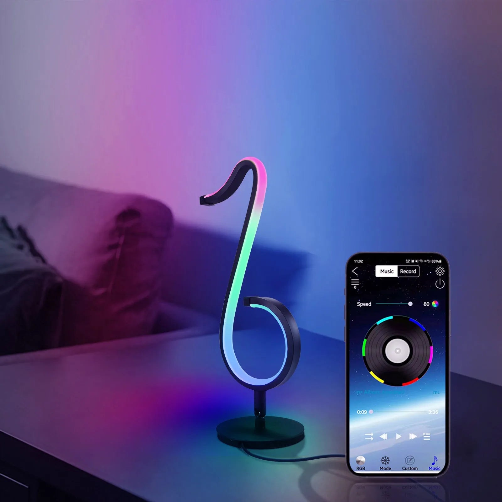 Black intelligent APP remote control LED atmosphere night light with 180 degree rotating chassis on a desk