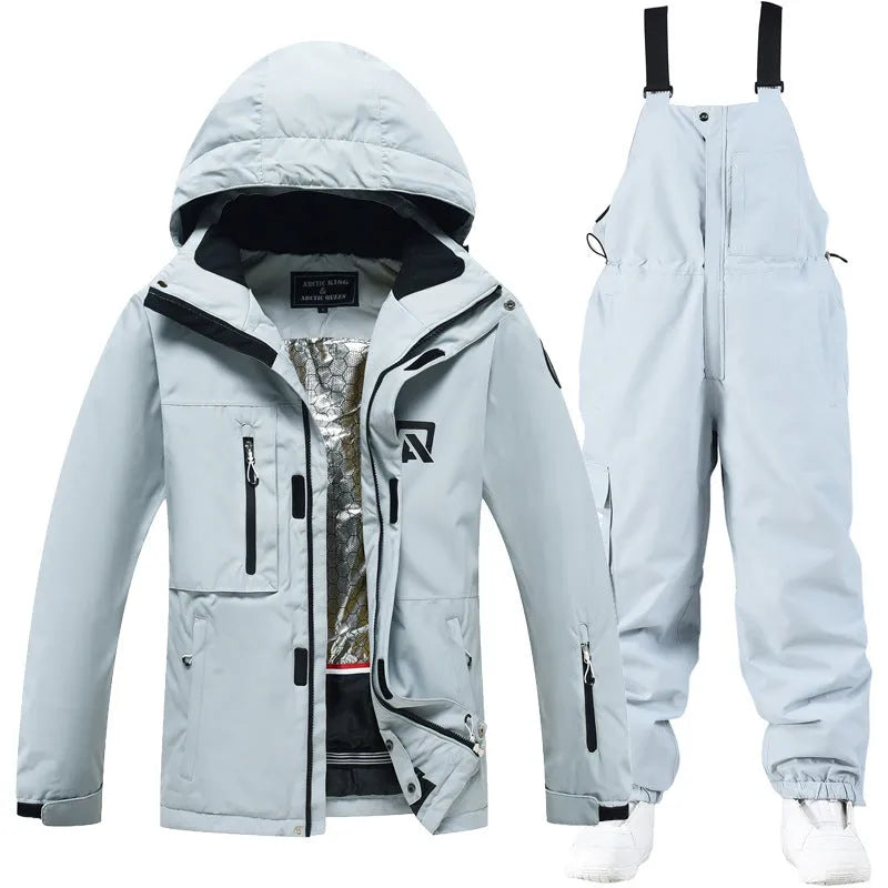 Unisex waterproof ski suit in blue top with black pants for winter snow sports