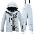 Unisex waterproof ski suit in blue top with black pants for winter snow sports