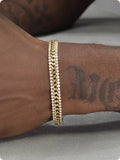 Gold tennis bracelet with titanium steel construction and artificial gemstone details