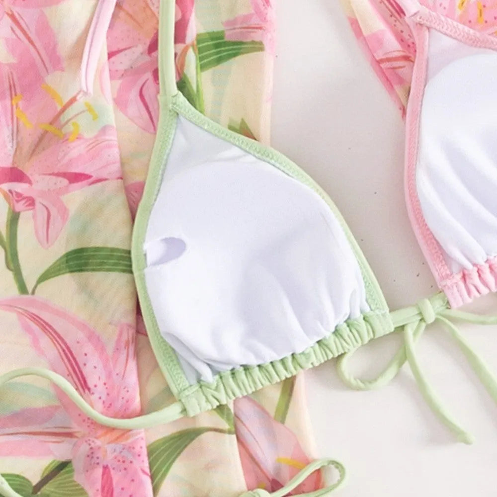 Colourful printed women's bikini swimsuit on a white background.