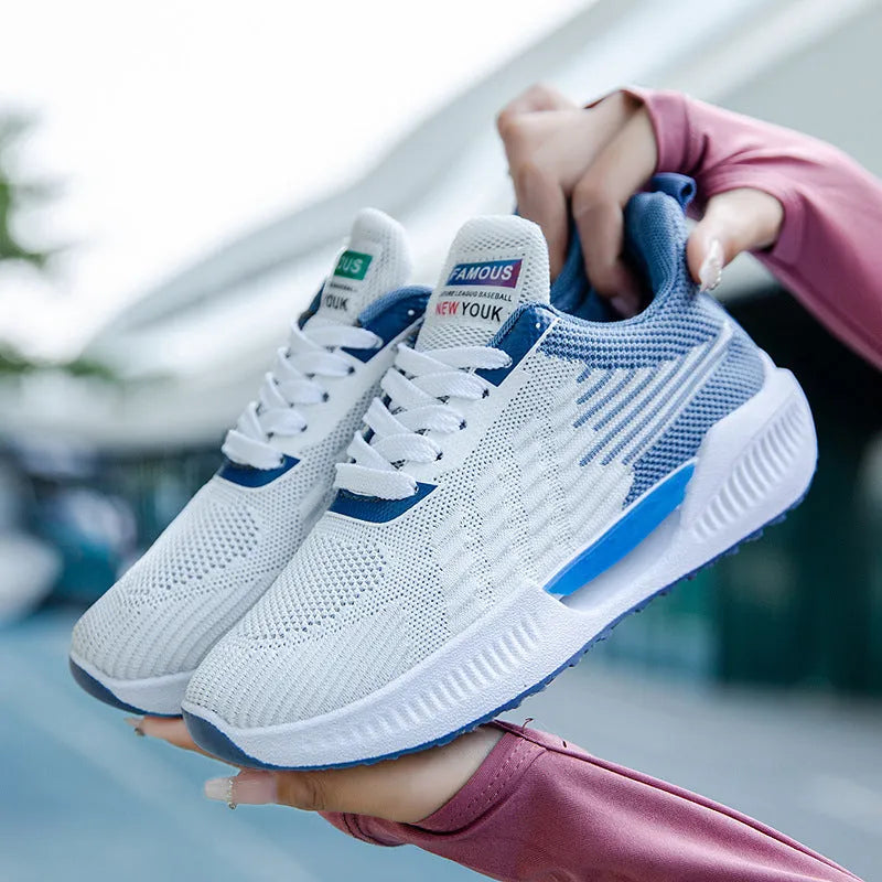 Men's blue casual mesh shoes with round toe and cloth upper on a white background.