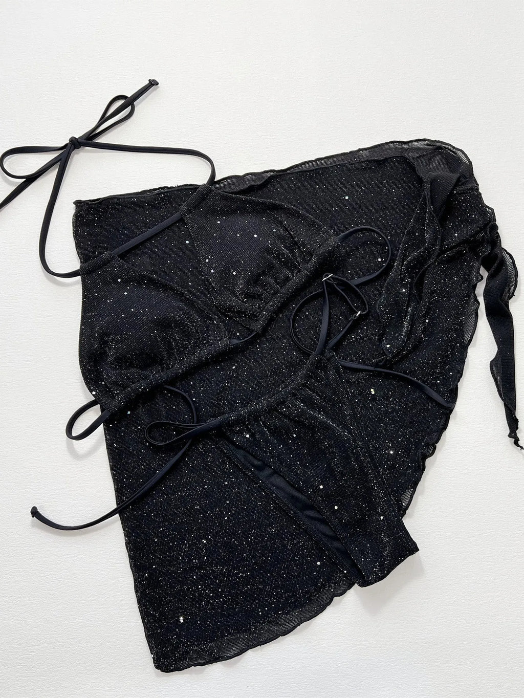Black three-piece women's bikini swimsuit with separate top and shorts