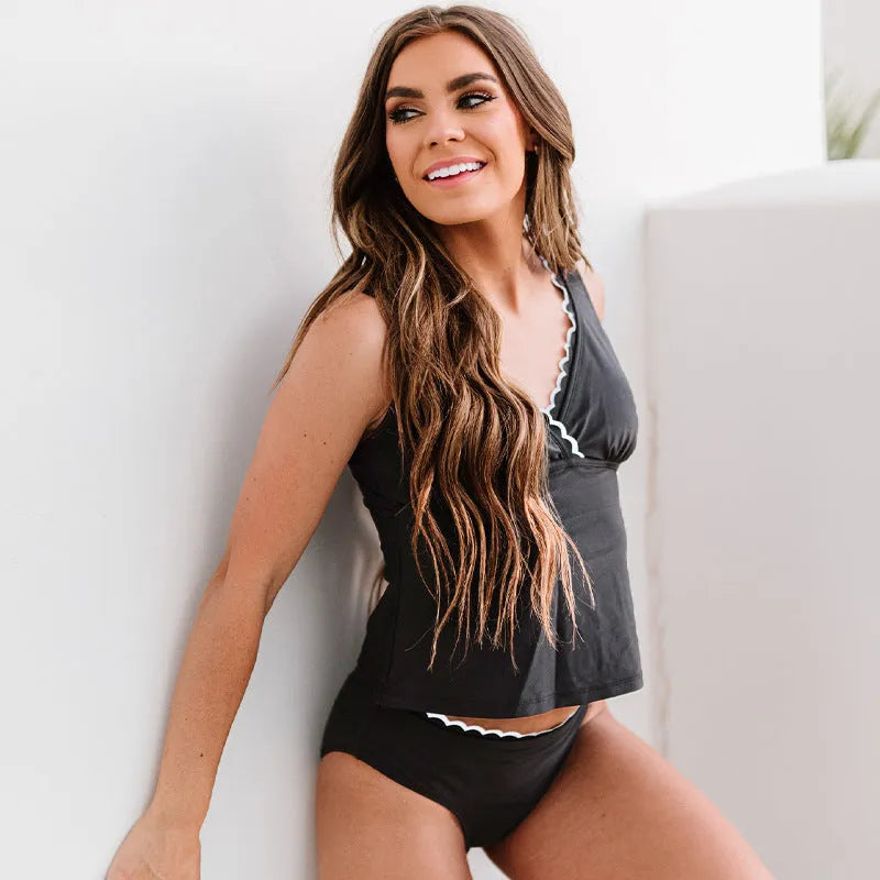 Black women's bikini swimsuit set with matching top and bottom on neutral background