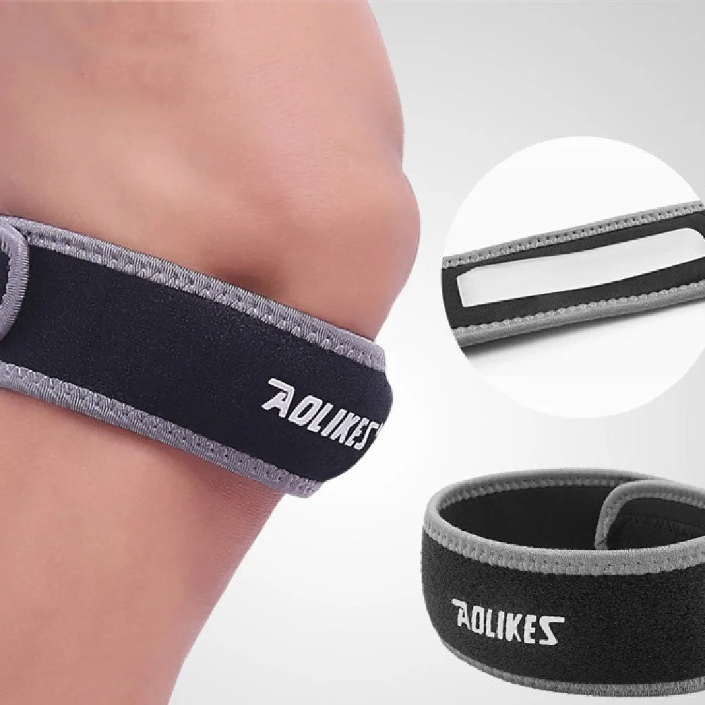 Black and grey patella retinaculum knee pad for outdoor sports protection.