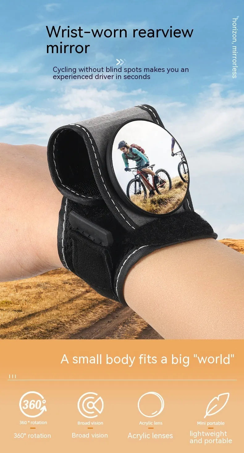 Black nylon wrist-mounted bicycle rear-view mirror shown on a cyclist's wrist.