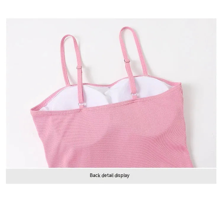 Women's long sleeve one-piece swimsuit in pink and black, showing front and back views.