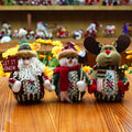 Red, green, and white flannel Christmas snowman decoration measuring 18 by 13 centimetres